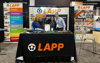 Victoria, Steve, Fifi, and Paul standing in front of the LAPP booth at ATX West
